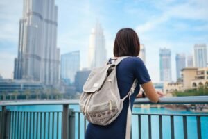 Young beautiful woman enjoying the view of Dubai downtown.